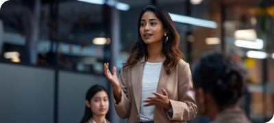 A woman is giving a presentation to a group of people.